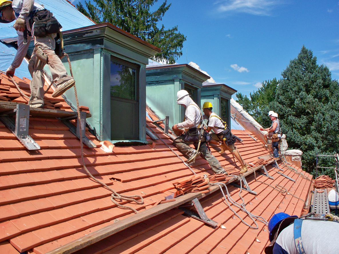 Alden Bailey roof workers on a historic tile roofing project