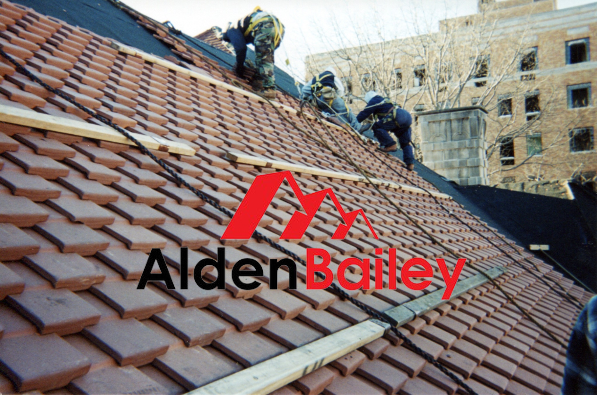Alden Bailey roof installation with logo over the roof photo